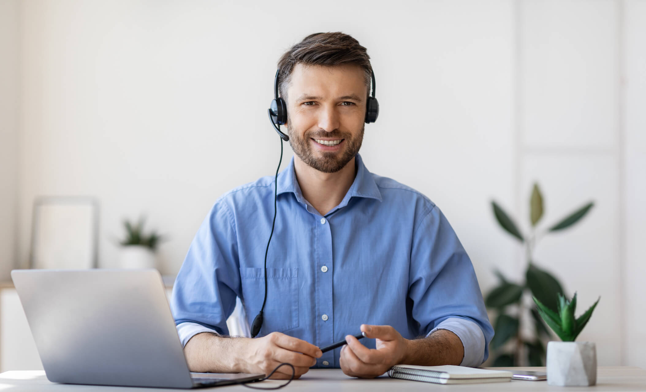 portrait-of-smiling-male-customer-service-operator-2021-08-29-10-29-33-utc.jpg